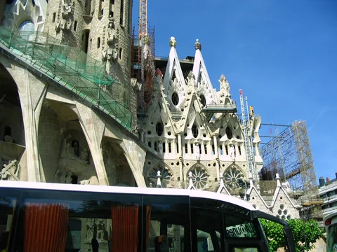 Passion facade and adjoining exterior of the Sagrada Familia with cranes